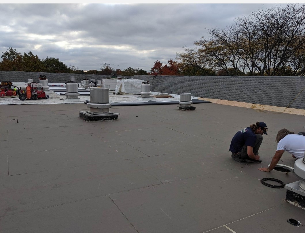 Commercial Flat Roofing Project - Alpine Roofing team installing EPDM membrane